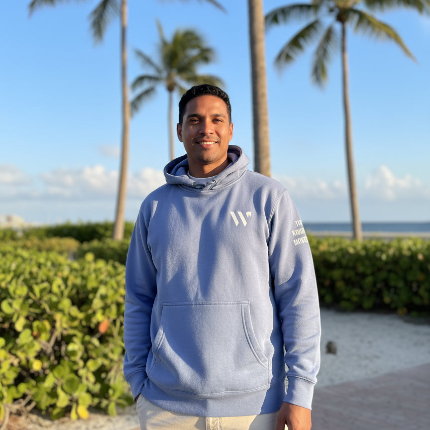 man wearing tkm be kind sweatshirt in florida