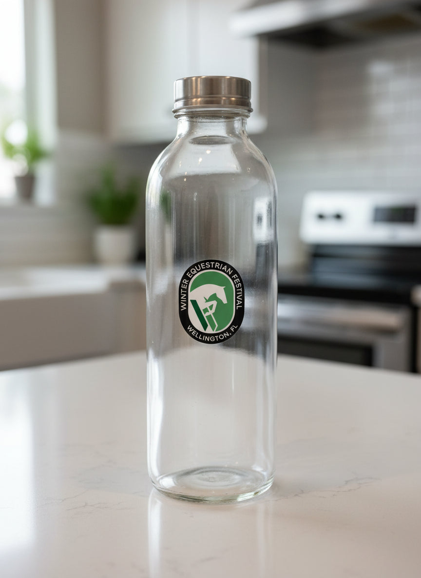 a wef sticker on a clear glass water bottle