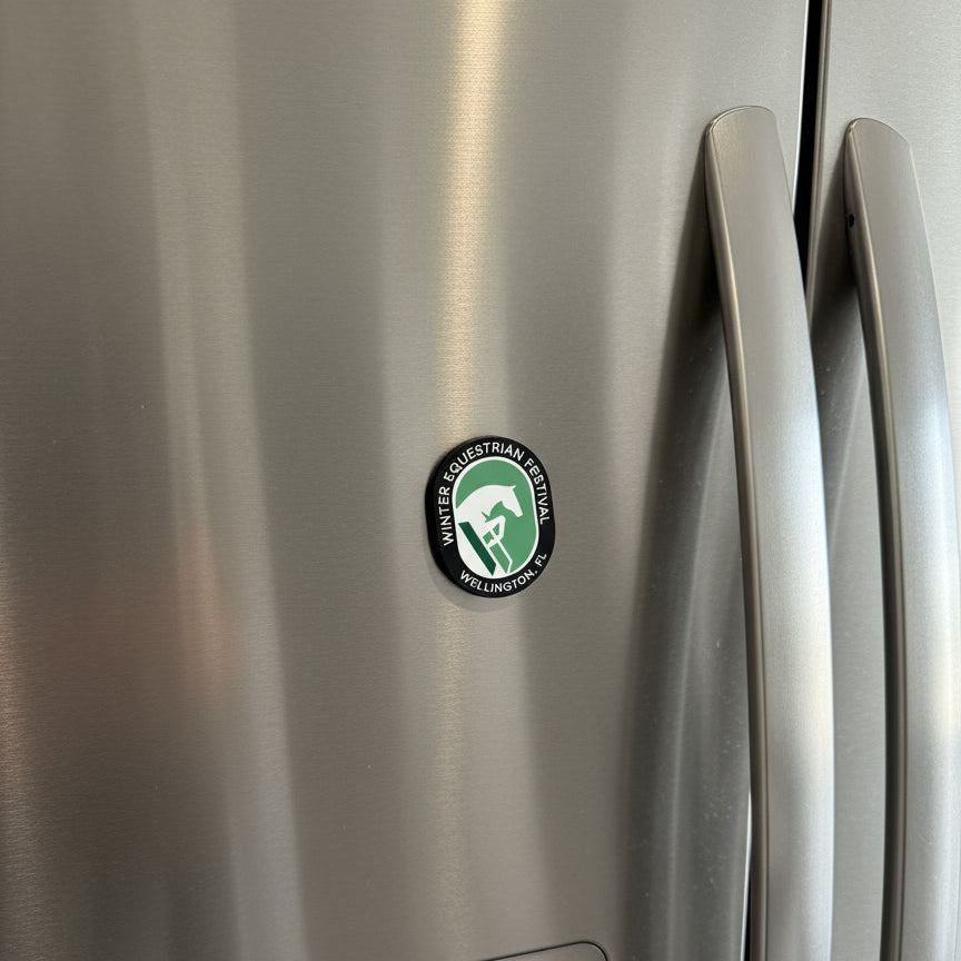 winter equestrian festival magnet on a refrigerator