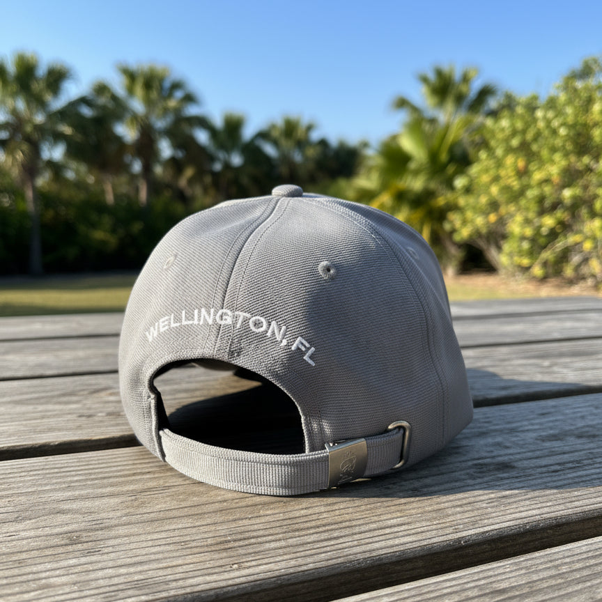 back view of grey Wellington International hat outside