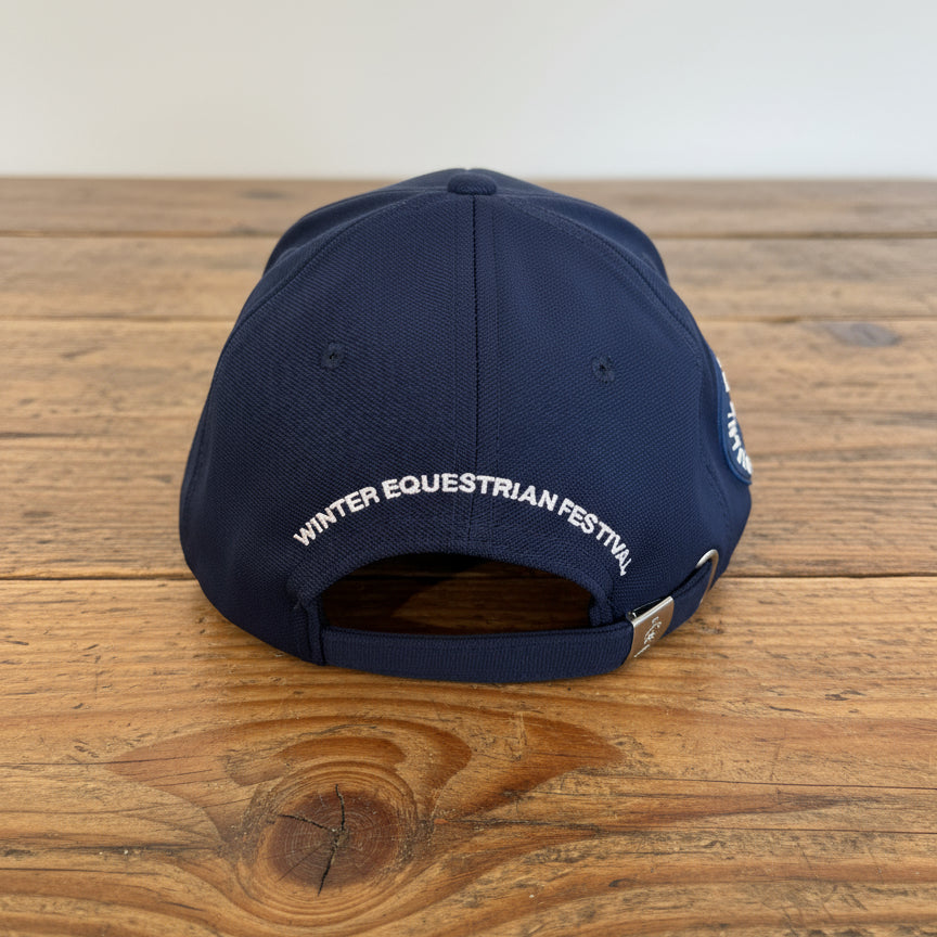 Back view of WEF hat in navy sitting on wooden table