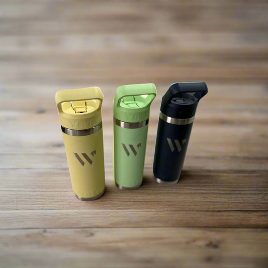 3 yeti tumblers on wooden table with wellington international logo