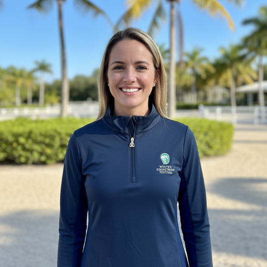 woman wearing the navy wef sunshirt outside