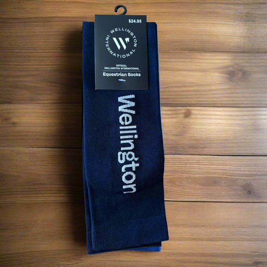 wellington international logo boot socks on a wooden table