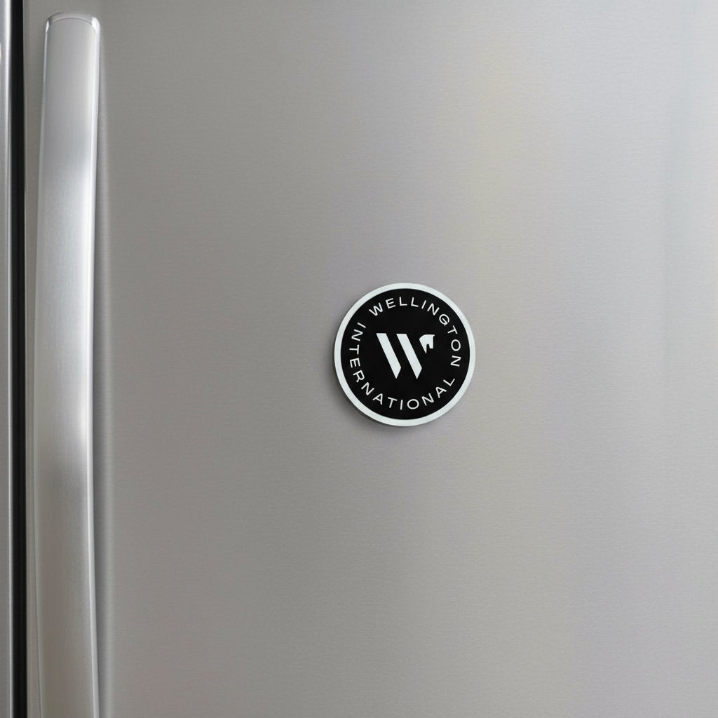 Circular logo with 'Wellington International' text and horse icon on a refridgerator 