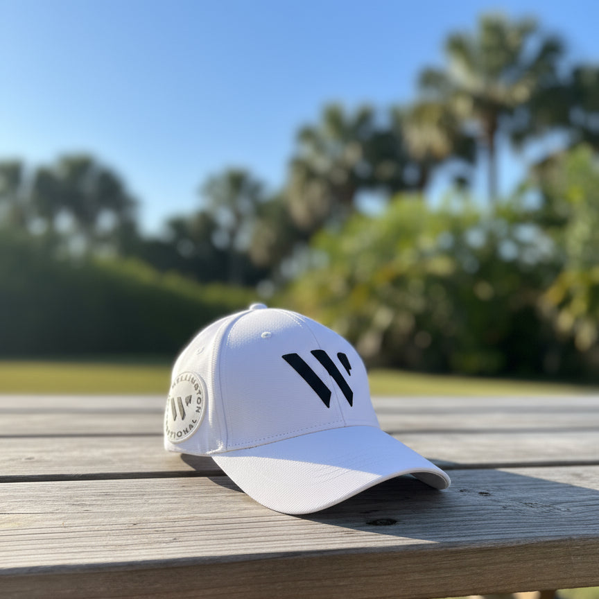 White Wellington International Hat on a wooden table outside