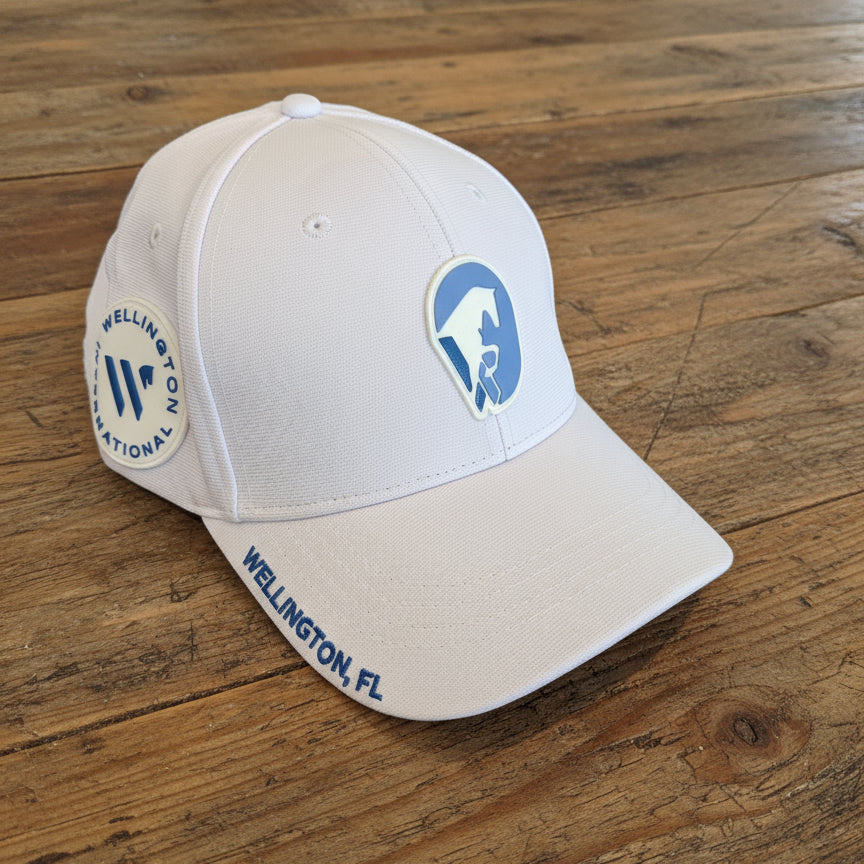 front view of gdf hat in white on wooden table