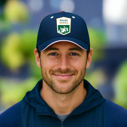 Man wearing a navy blue cap with Rolex Series equestrian logo outside