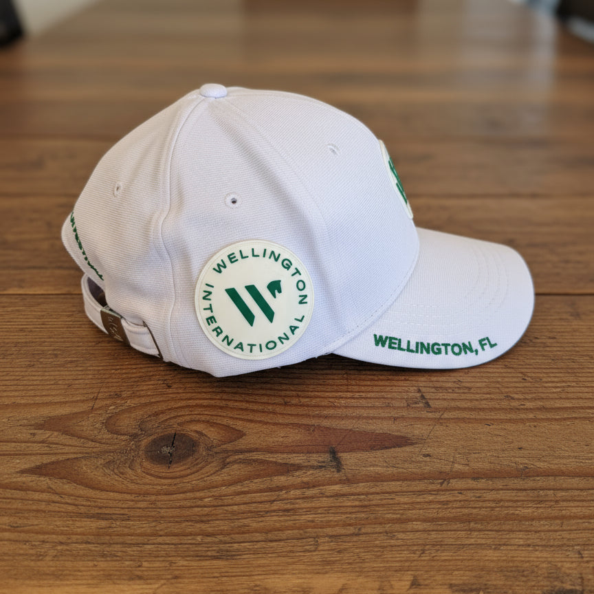 side view of white wef hat on wooden table